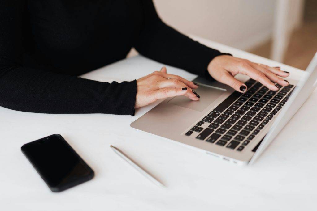 pr professional working on a pr strategy on a laptop